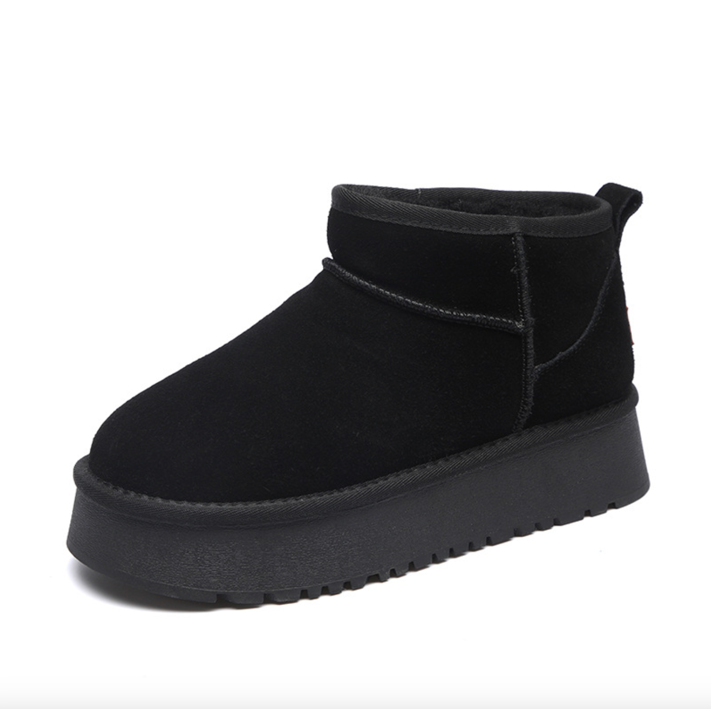 Black ankle boot with a textured upper and thick platform sole. Ideal for casual wear.